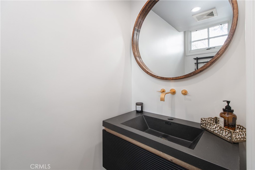 23057 Park Este Calabasas, CA 91302 - Photo 10 of 31 a bathroom with a sink and a mirror