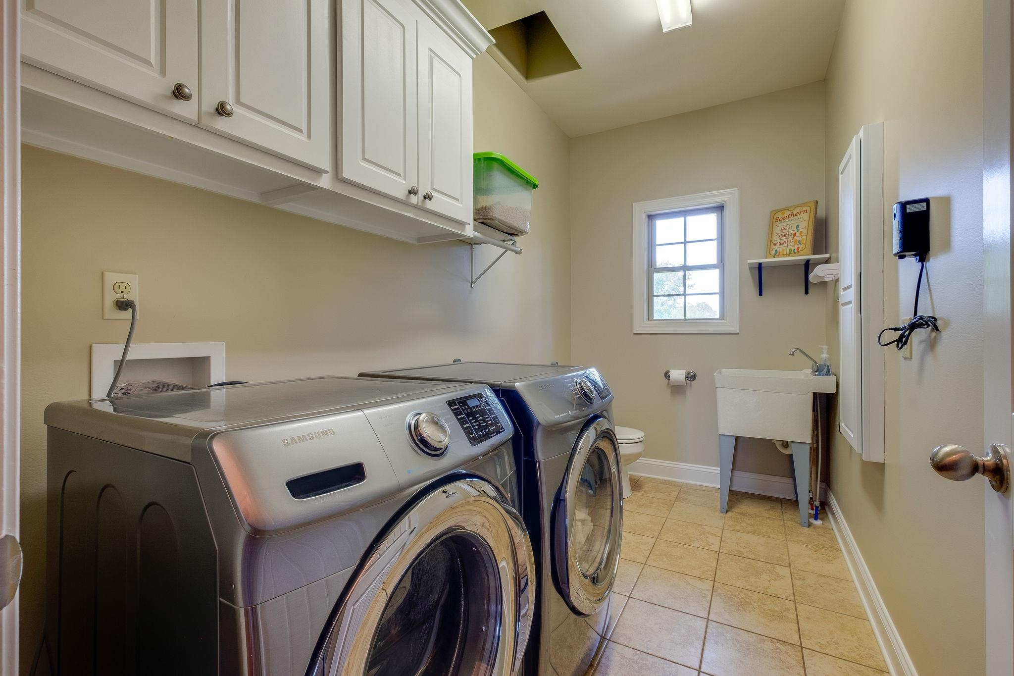 4110 Central Valley Road Murfreesboro, TN 37129 - Photo 14 of 30 Large laundry room with laundry shoot from 2nd floor, built in ironing board and utility sink.