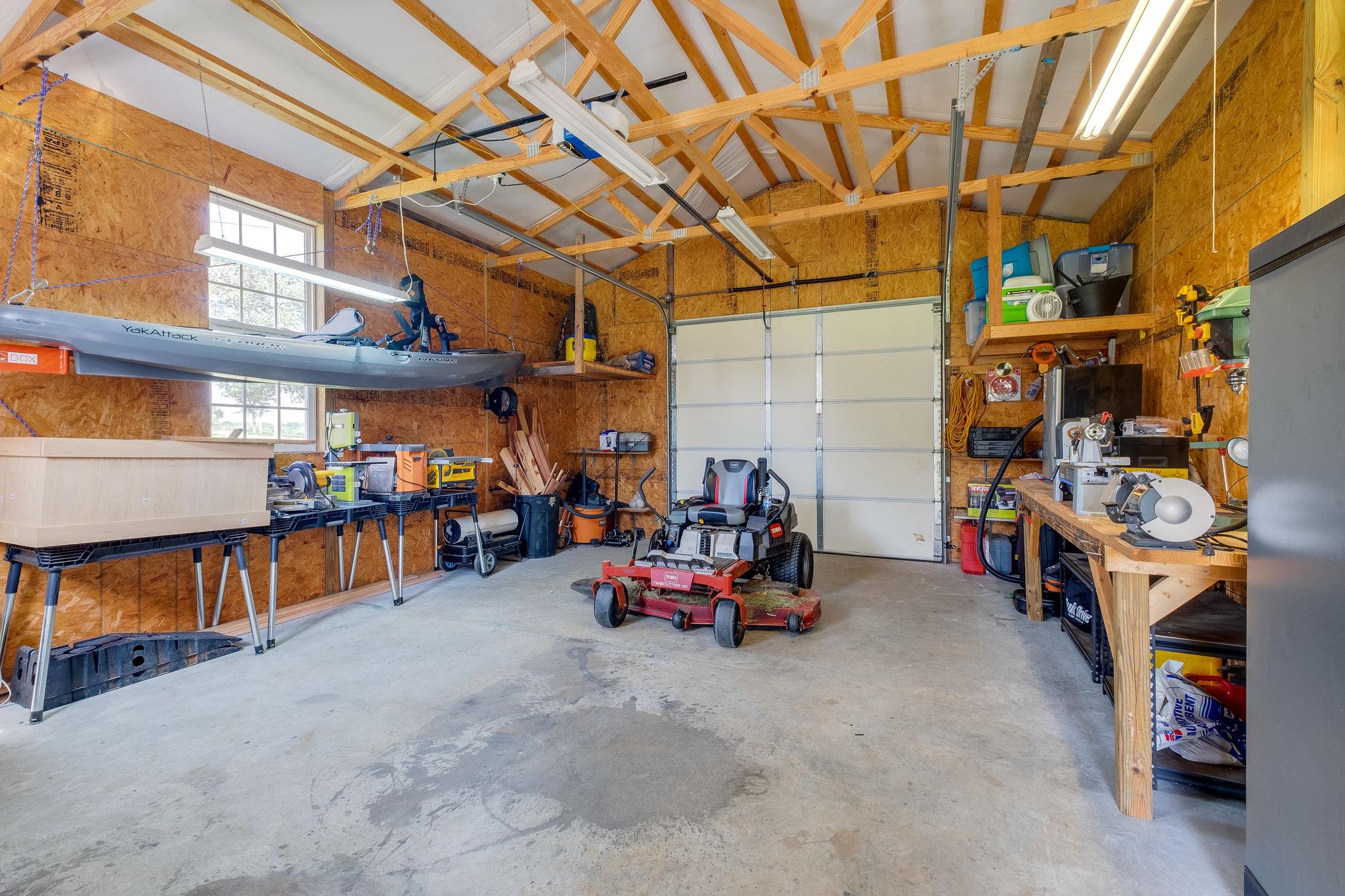 4110 Central Valley Road Murfreesboro, TN 37129 - Photo 27 of 30 Detached shop is insulated, heated and cooled, and has powered garage door.