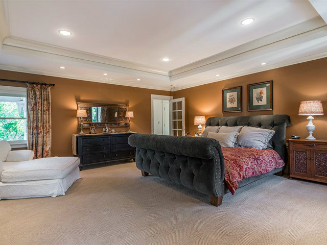 224 Warren Road San Mateo, CA 94402 - Photo 14 of 25 a spacious bedroom with a large bed and wooden floor