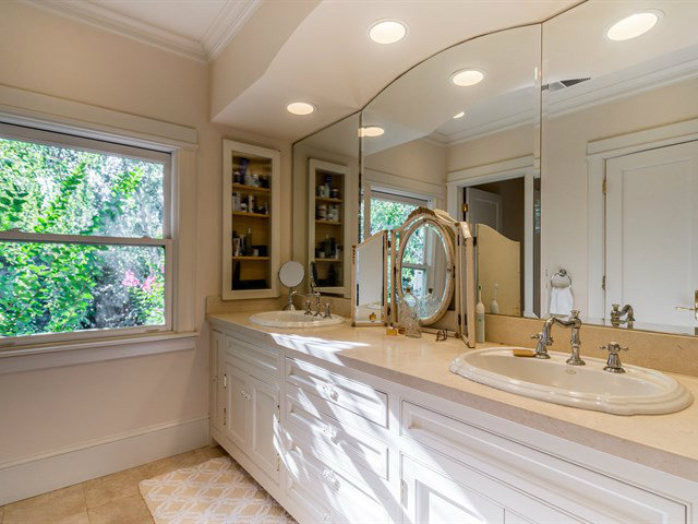 224 Warren Road San Mateo, CA 94402 - Photo 16 of 25 a bathroom with a double vanity sink and a large mirror