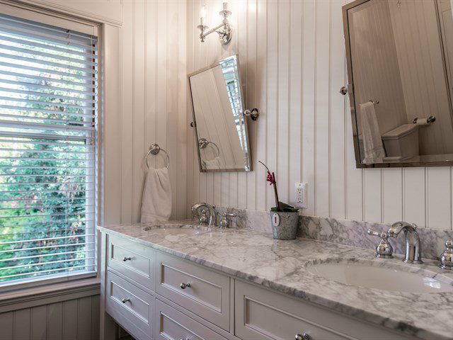 224 Warren Road San Mateo, CA 94402 - Photo 20 of 25 a bathroom with a granite countertop sink and a mirror
