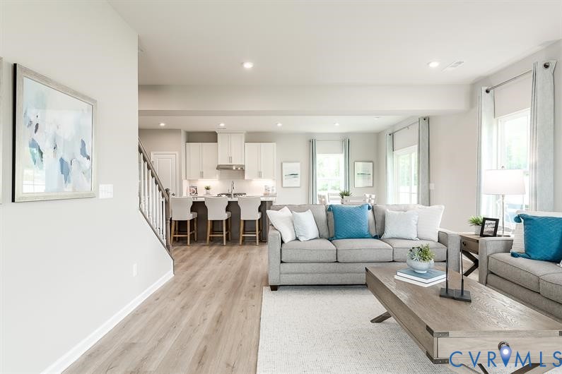 5 Driver Lane Richmond, VA 23223 - Photo 11 of 25 a living room with furniture and a large window