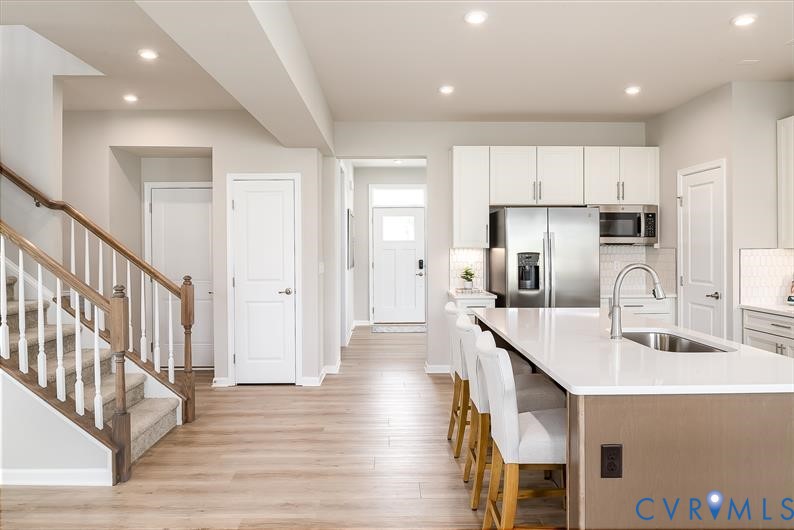 5 Driver Lane Richmond, VA 23223 - Photo 6 of 25 a kitchen with counter top space cabinets and wooden floor