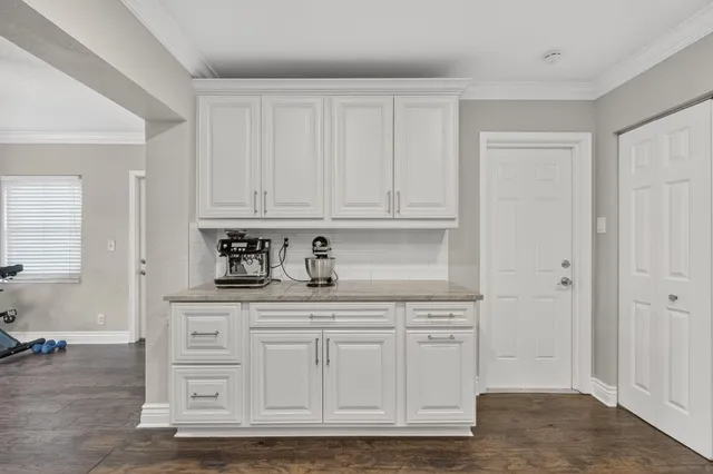 a view of cabinets with wooden floor