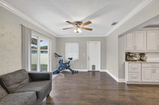a living room with furniture and windows