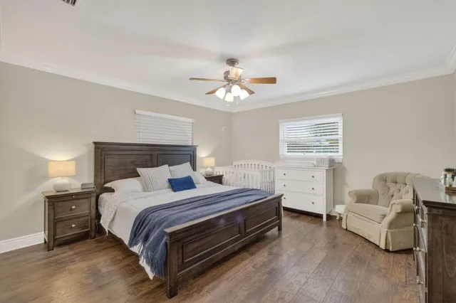 a bedroom with a bed and a couch