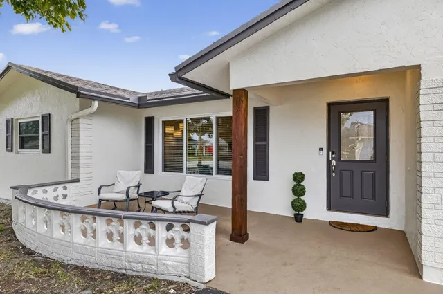 a living room with furniture and window