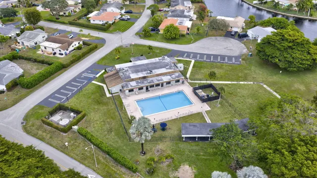 an aerial view of multiple houses with yard