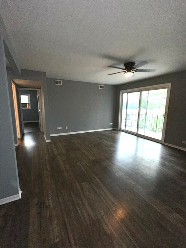 11036 Kilpatrick Avenue, Unit 3SW Oak Lawn, IL 60453 - Photo 2 of 9 wooden floor in an empty room with a window