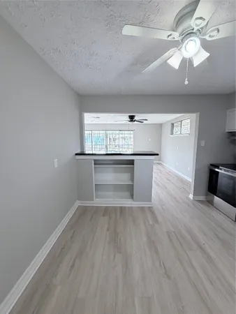 a view of kitchen and sink with wooden floor