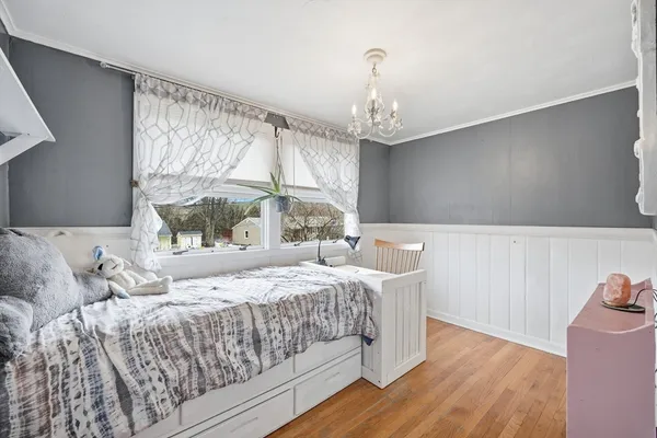 a bedroom with a bed and a table