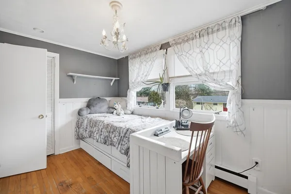 a bedroom with a bed and a table