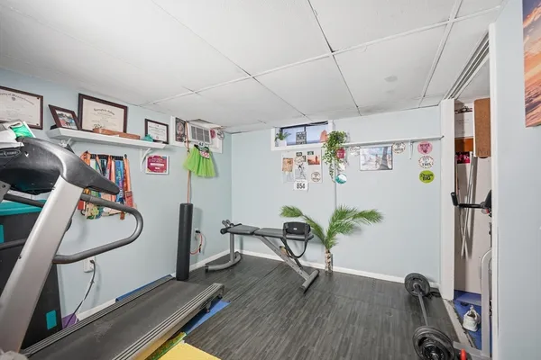a view of a workspace with furniture and a workspace