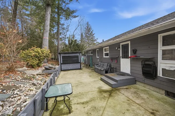 a view of house with outdoor seating area