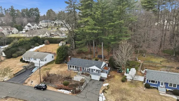 an aerial view of a house with outdoor space