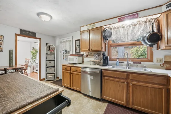 a kitchen with stainless steel appliances a sink and a stove