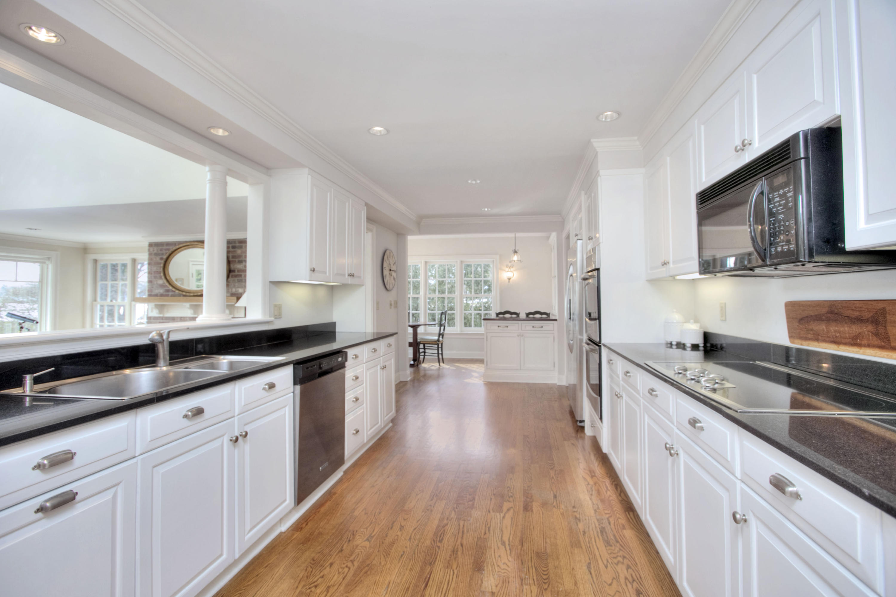 9 Seagate Road Darien, CT 06820 - Photo 15 of 32 a large kitchen with stainless steel appliances granite countertop a lot of counter space and wooden floors