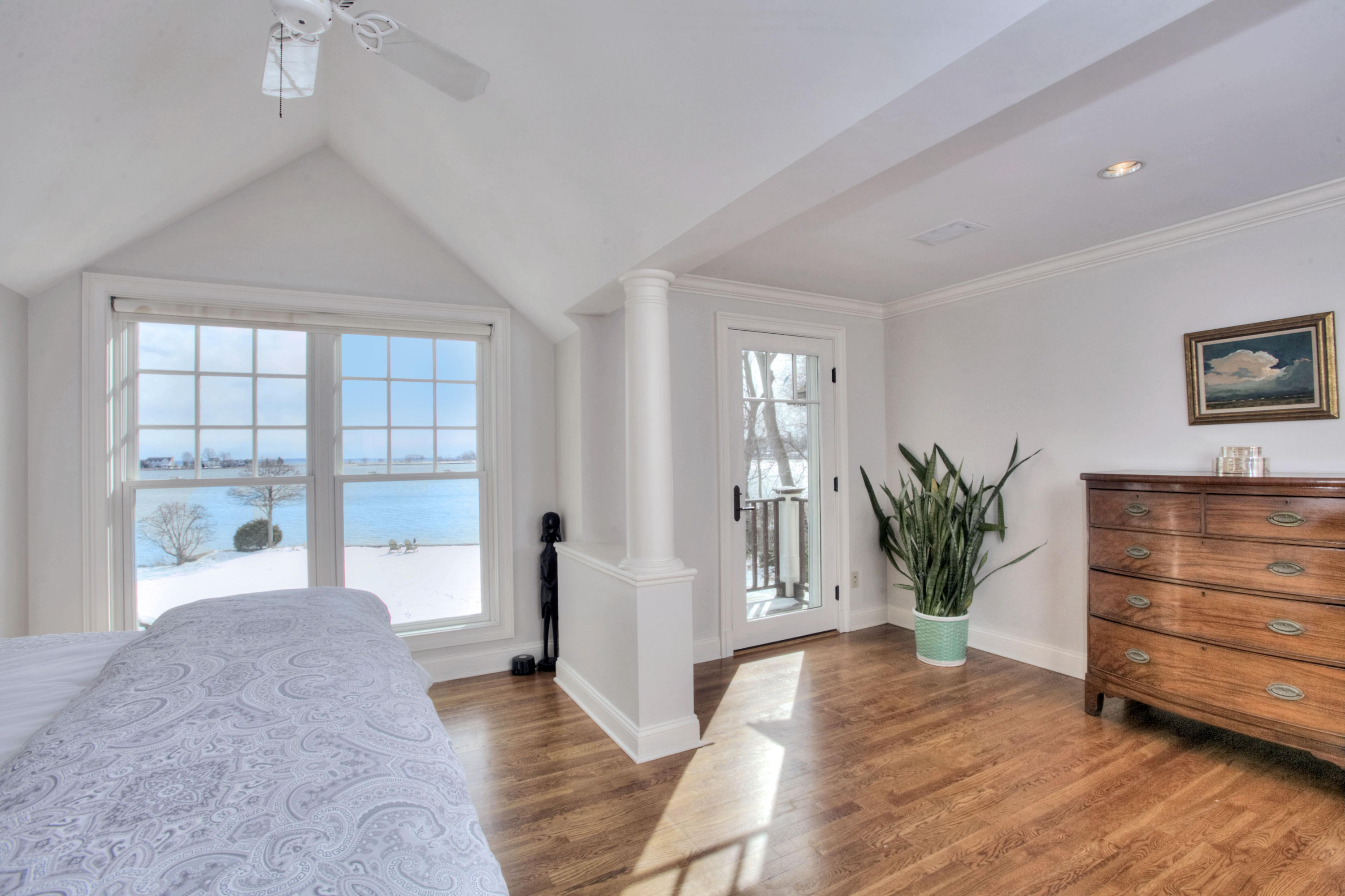 9 Seagate Road Darien, CT 06820 - Photo 19 of 32 a view of an empty room with a window and wooden floor