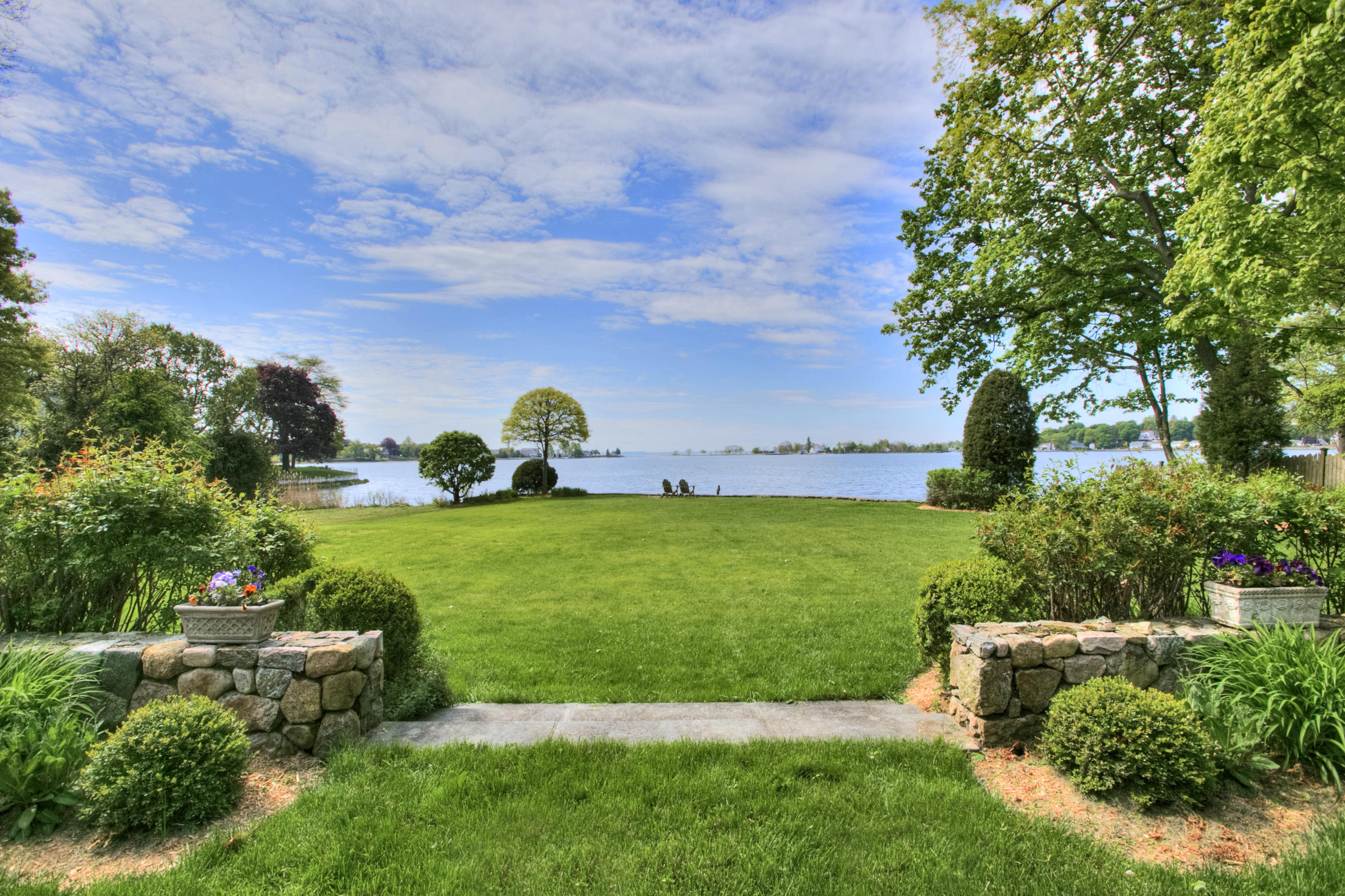 9 Seagate Road Darien, CT 06820 - Photo 3 of 32 a view of a garden with lawn chairs