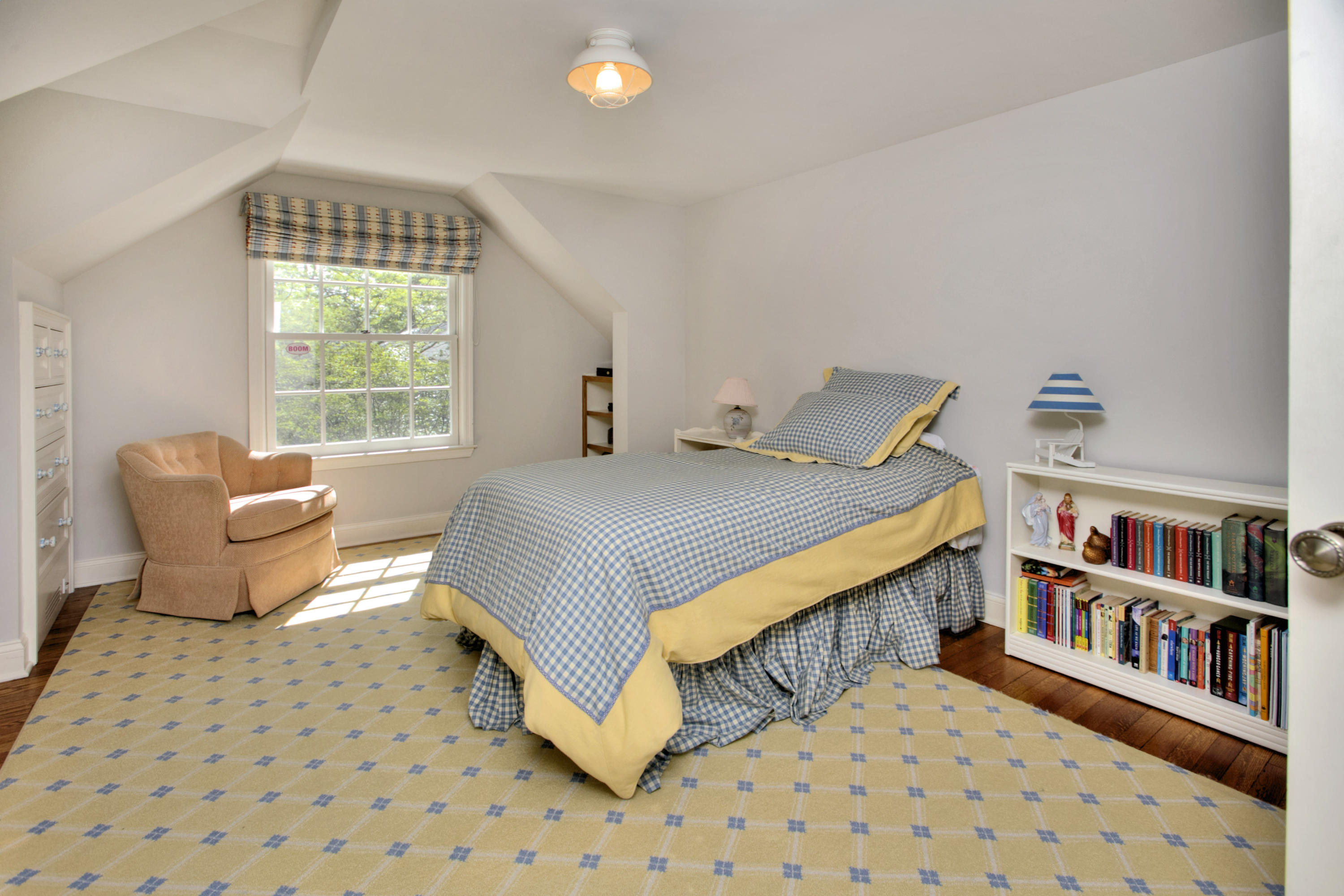 9 Seagate Road Darien, CT 06820 - Photo 22 of 32 a bedroom with furniture window and book shelf