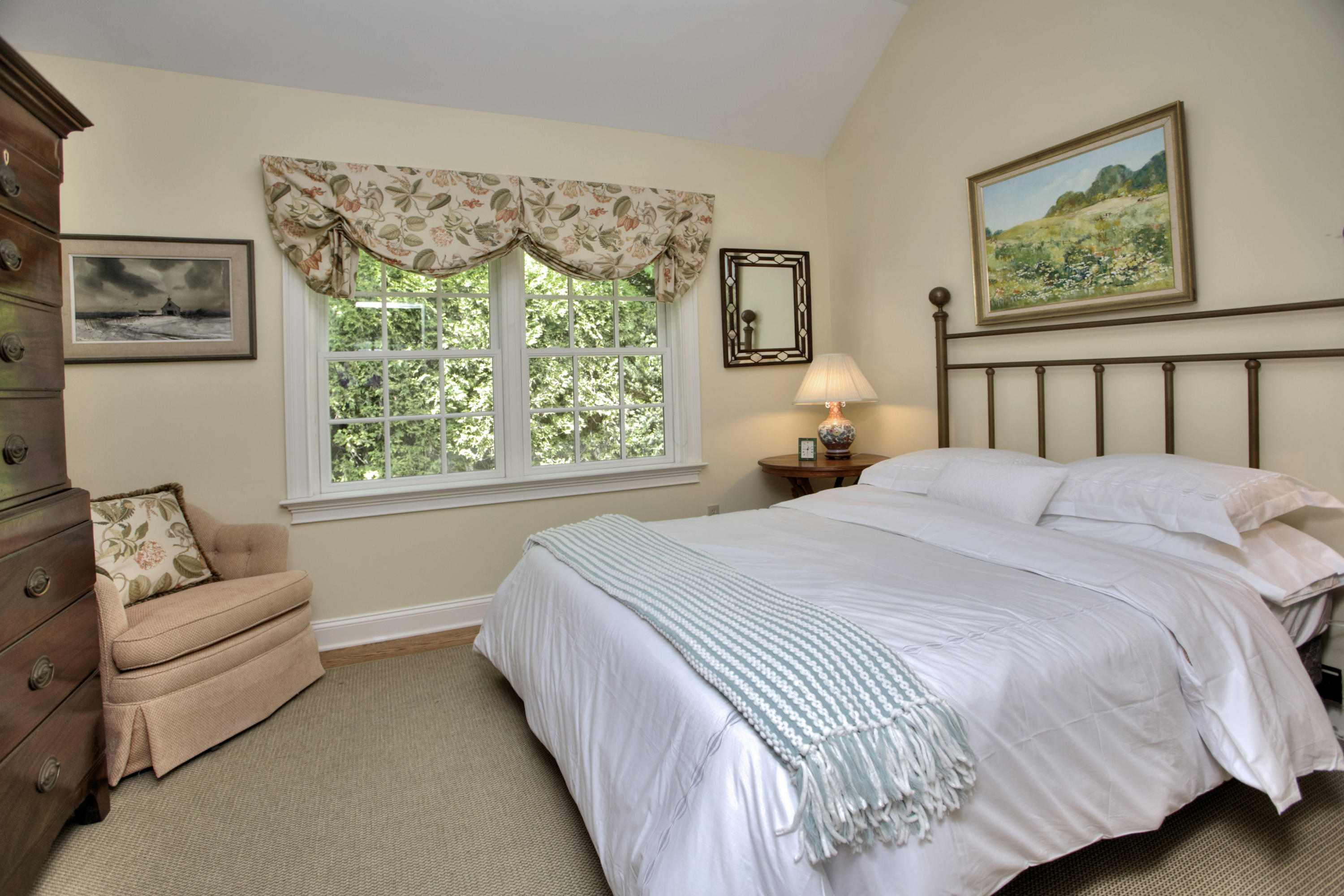9 Seagate Road Darien, CT 06820 - Photo 23 of 32 a bedroom with a large bed couch and a window