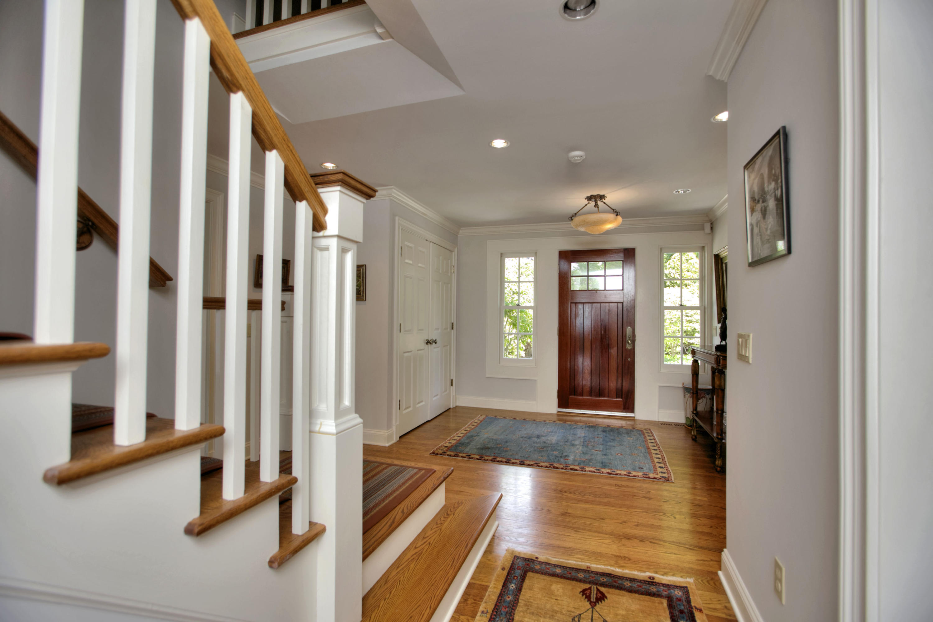 9 Seagate Road Darien, CT 06820 - Photo 26 of 32 a view of a hallway with wooden floor and entryway