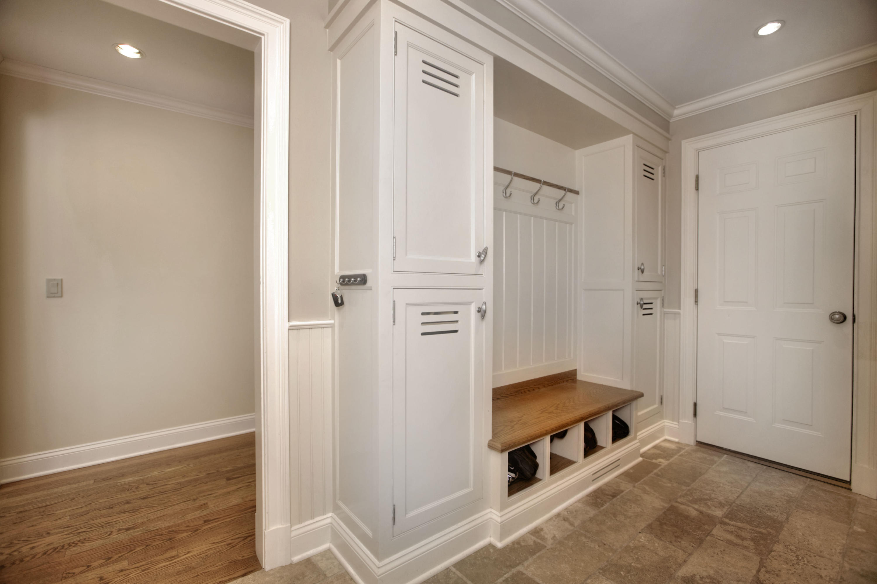 9 Seagate Road Darien, CT 06820 - Photo 27 of 32 a hallway with sliding door and front door