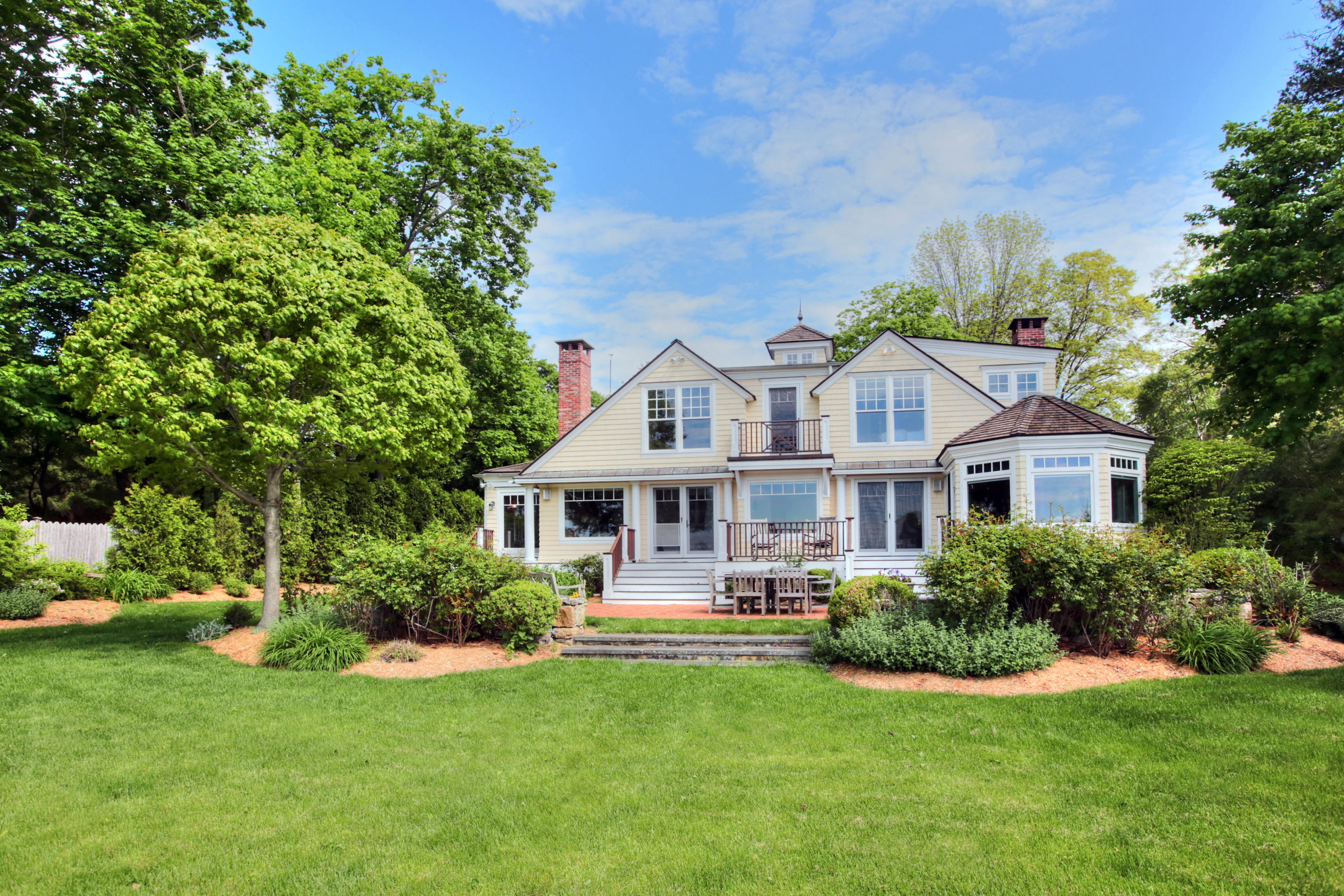 9 Seagate Road Darien, CT 06820 - Photo 29 of 32 a front view of a house with yard and green space