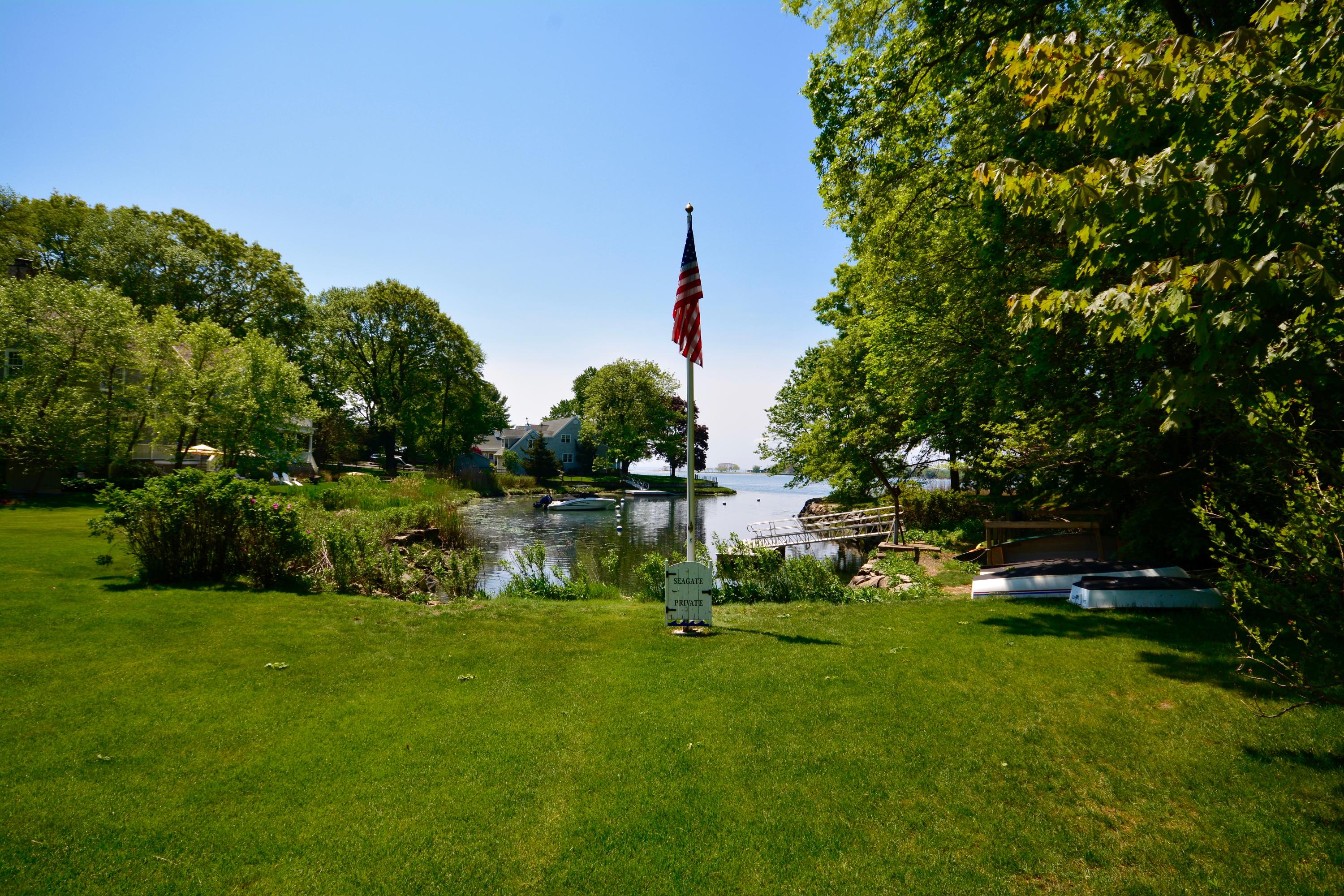 9 Seagate Road Darien, CT 06820 - Photo 32 of 32 a backyard of a house with lots of green space