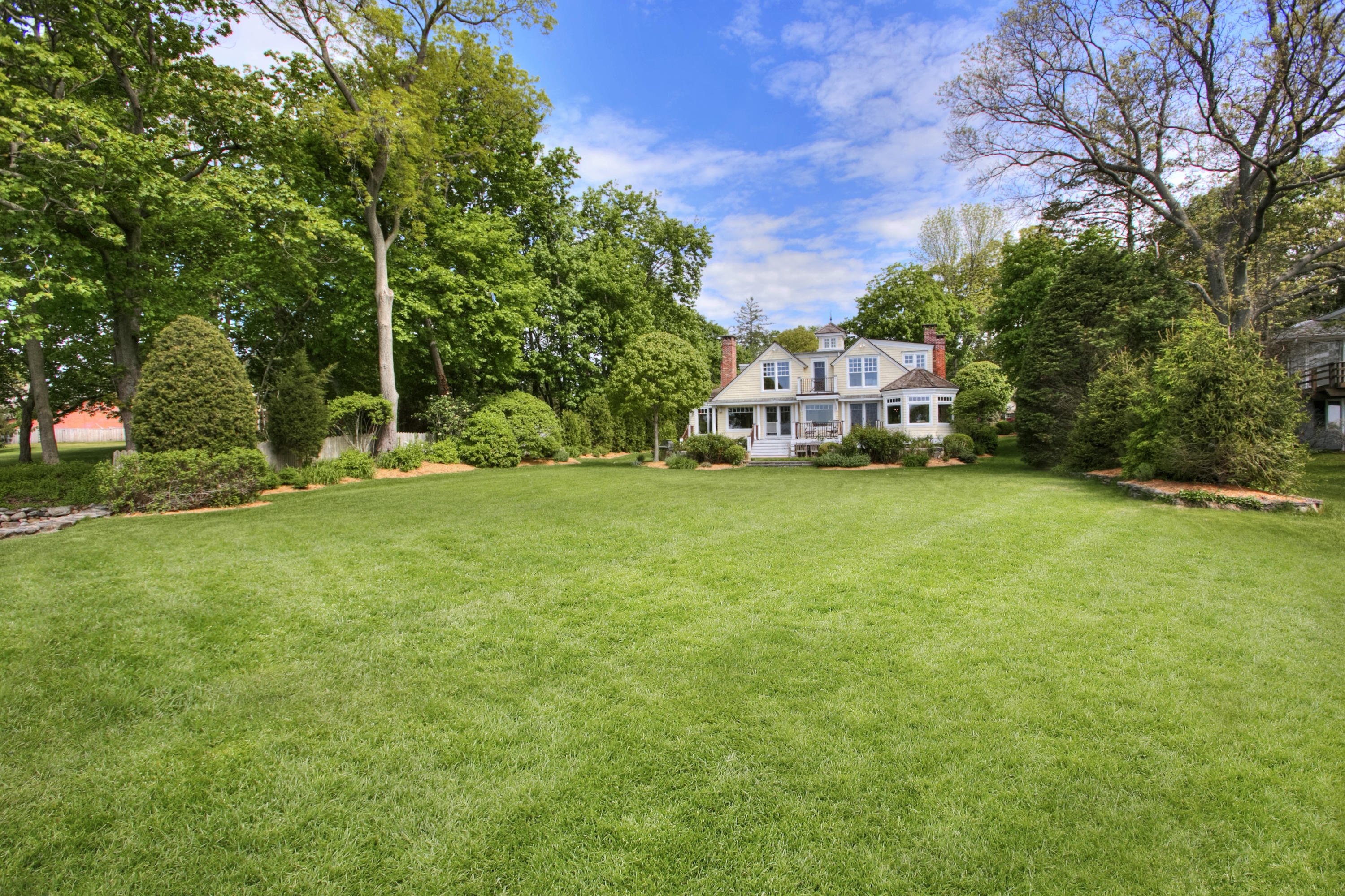 9 Seagate Road Darien, CT 06820 - Photo 7 of 32 a view of a house with a yard and sitting area
