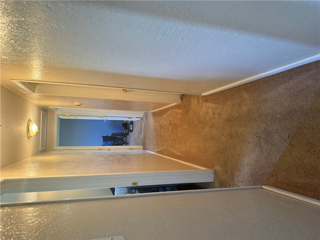 5840 Pitchin Road South Springfield, OH 45502 - Photo 11 of 18 This cozy hallway features soft carpeting and classic interior lighting.