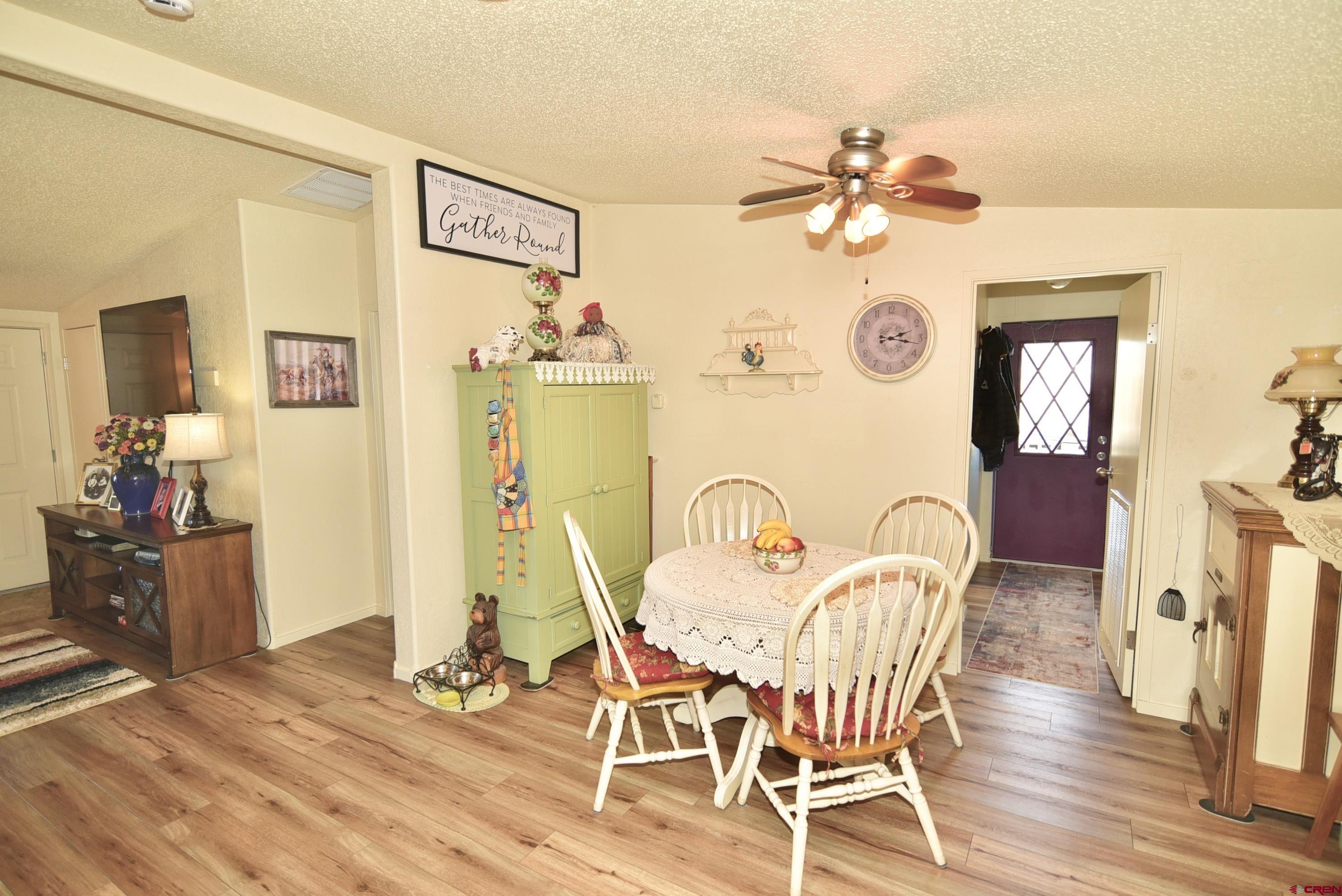 20020 Kenosha Road Austin, CO 81410 - Photo 12 of 40 a view of a dining room with furniture and wooden floor
