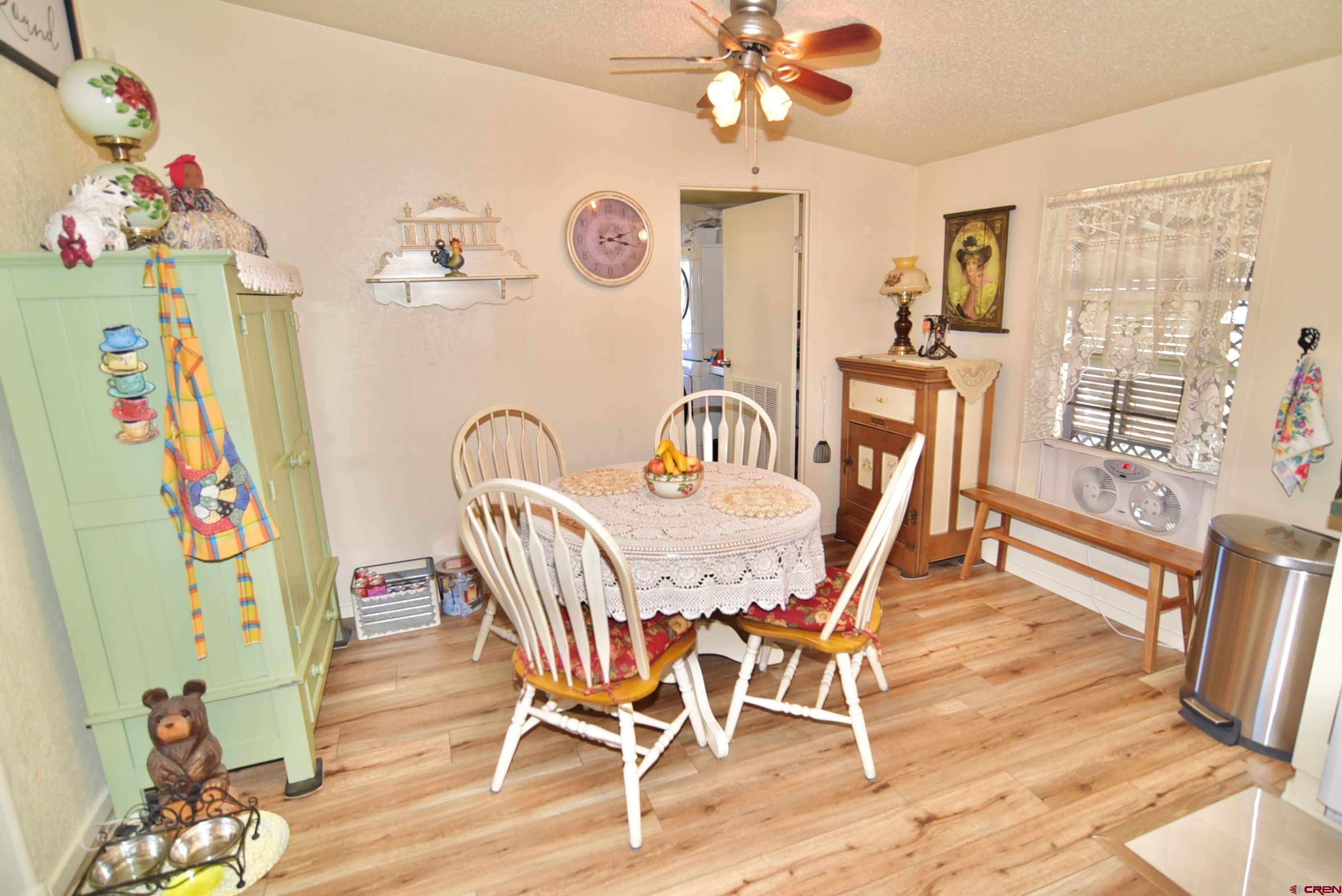20020 Kenosha Road Austin, CO 81410 - Photo 13 of 40 a view of a dining room with furniture and wooden floor