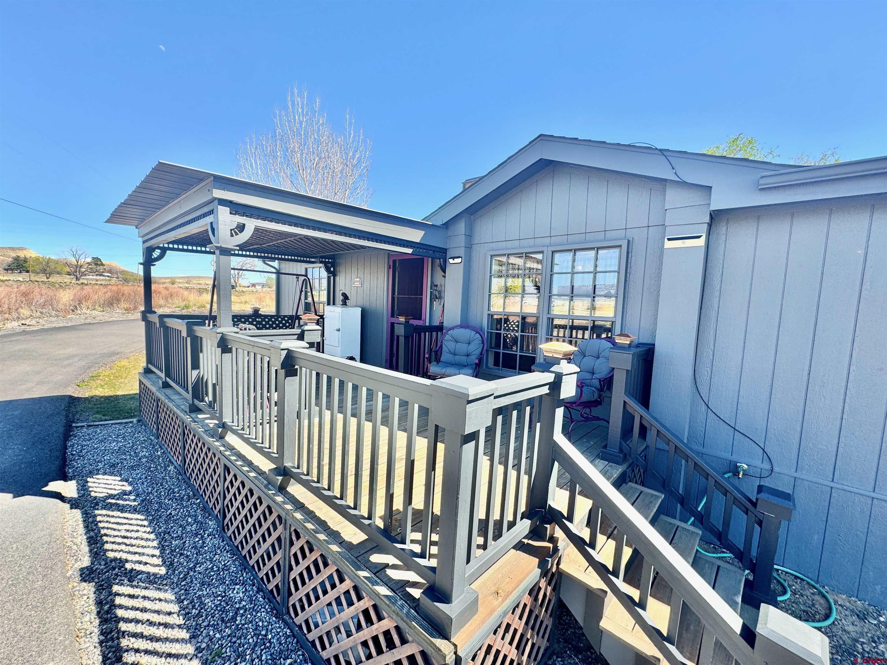20020 Kenosha Road Austin, CO 81410 - Photo 2 of 40 a view of a house with wooden deck