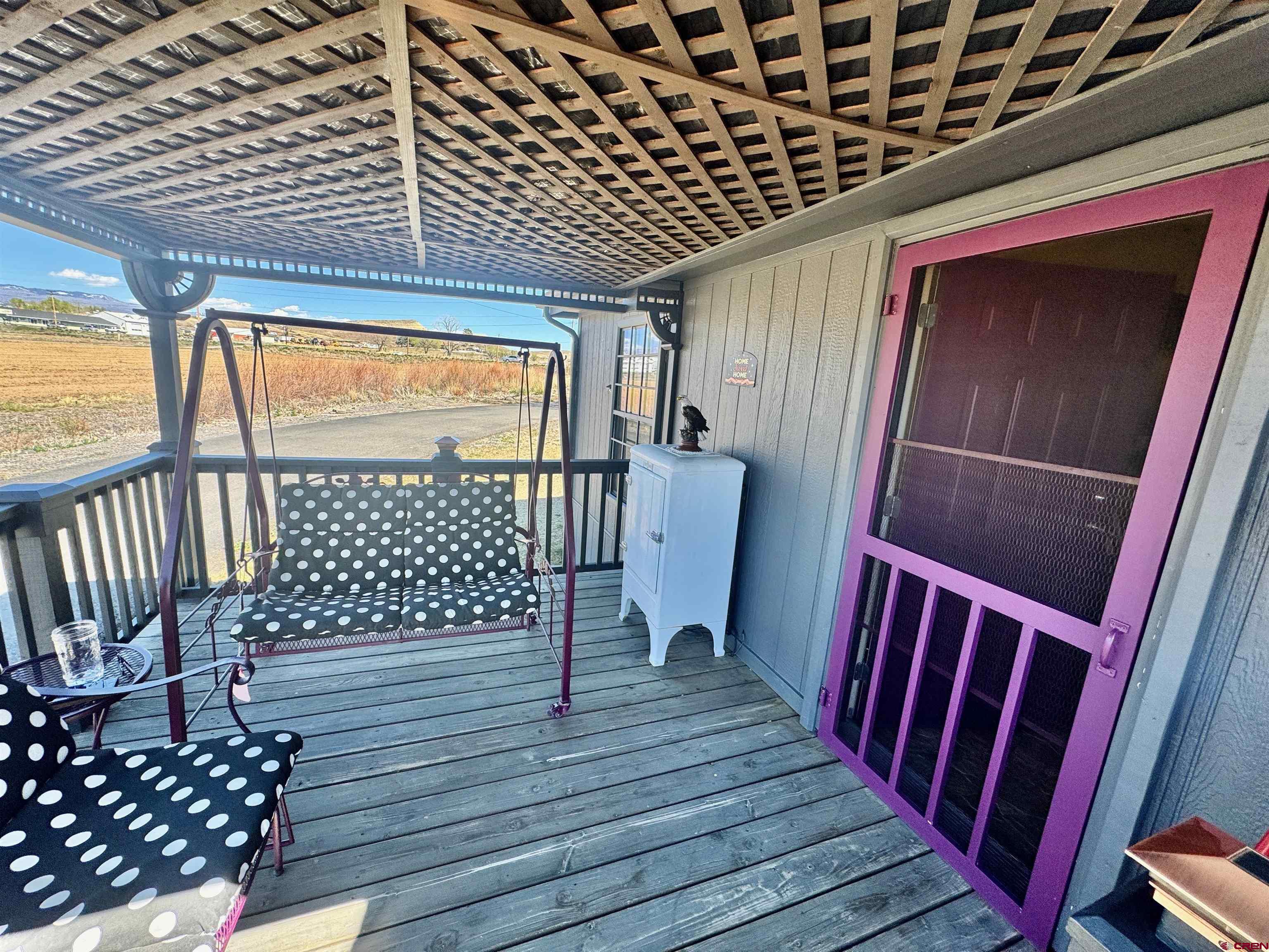 20020 Kenosha Road Austin, CO 81410 - Photo 25 of 40 a view of porch with wooden floor