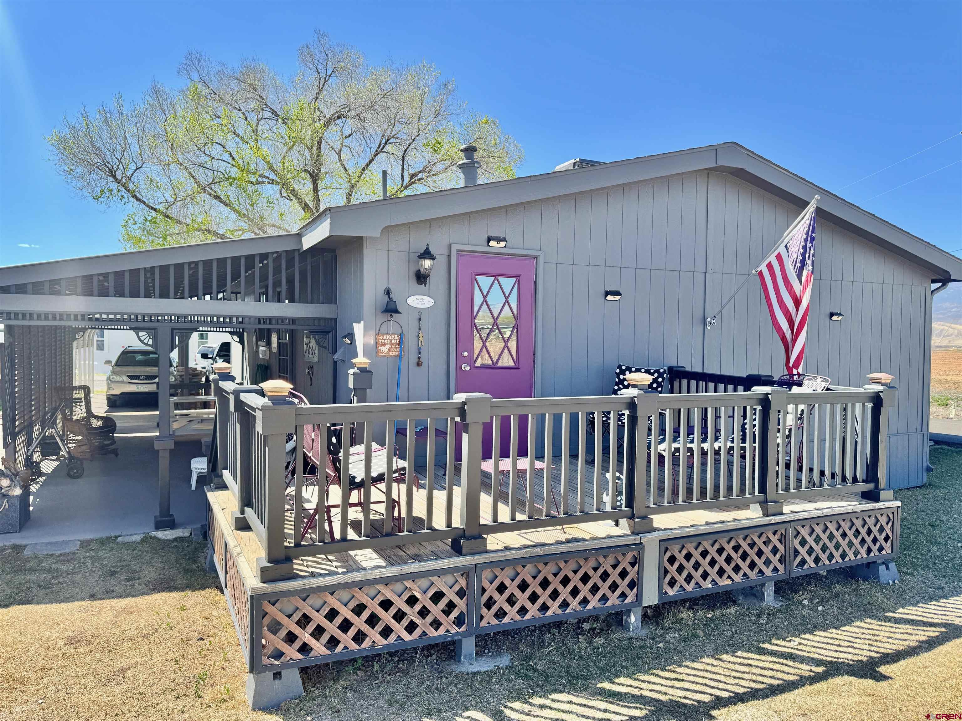 20020 Kenosha Road Austin, CO 81410 - Photo 28 of 40 a view of a chairs on wooden deck