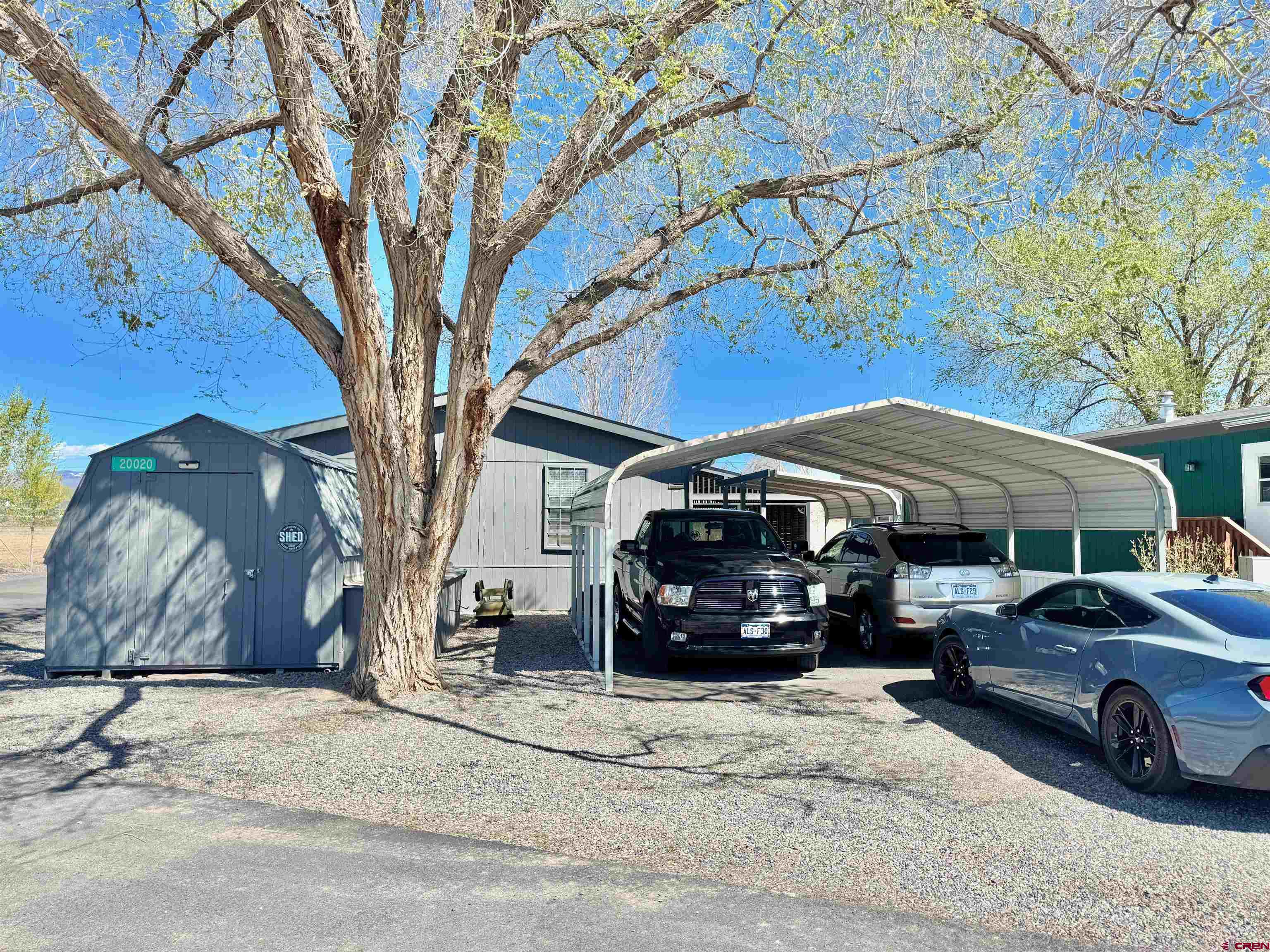 20020 Kenosha Road Austin, CO 81410 - Photo 3 of 40 a view of a car parked in front of house
