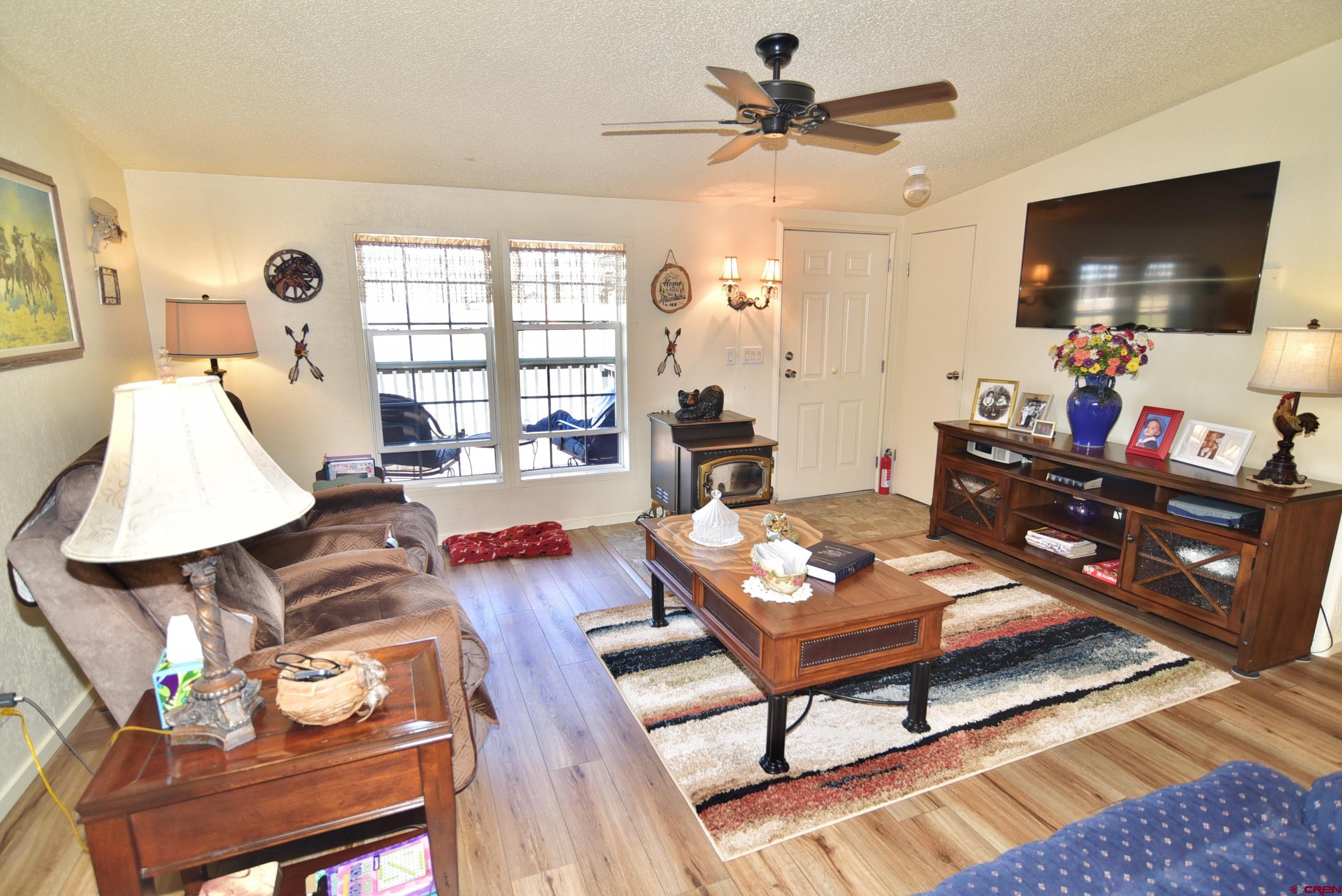 20020 Kenosha Road Austin, CO 81410 - Photo 5 of 40 a living room with furniture and a flat screen tv