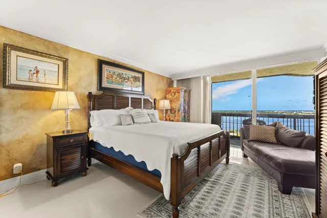 a spacious bedroom with a bed and a couch