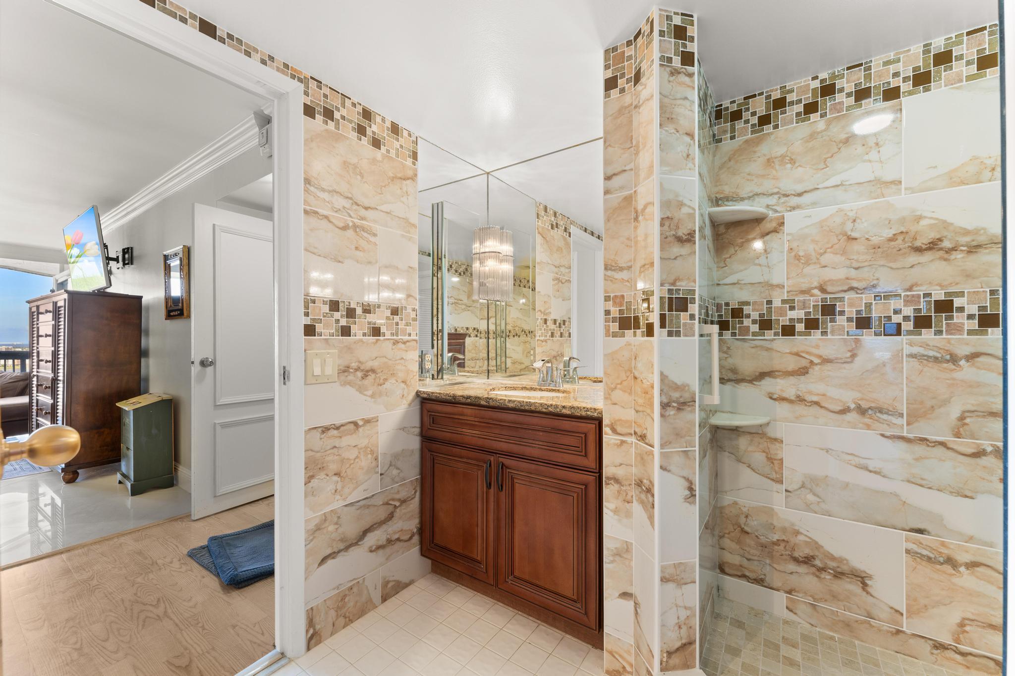 1900 Consulate Place, Unit 2002 West Palm Beach, FL 33401 - Photo 18 of 29 a bathroom with a shower