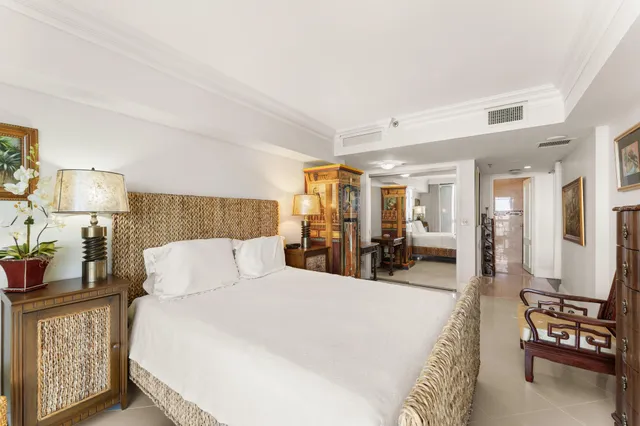 a bed room with a bed and a lamp