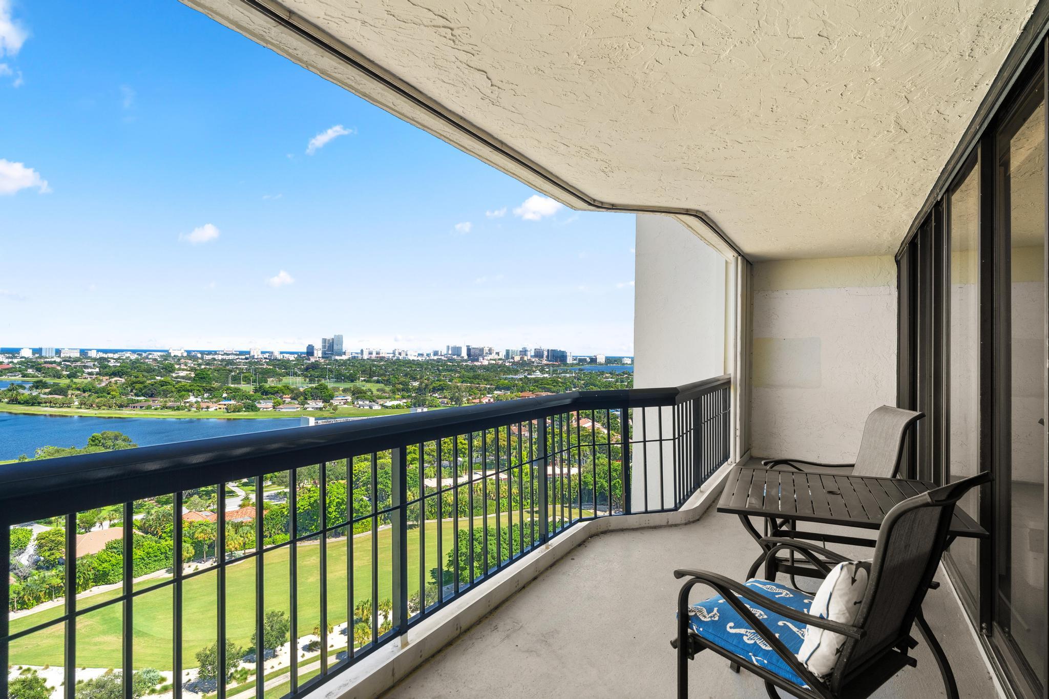 1900 Consulate Place, Unit 2002 West Palm Beach, FL 33401 - Photo 23 of 29 a view of a two chair in the balcony