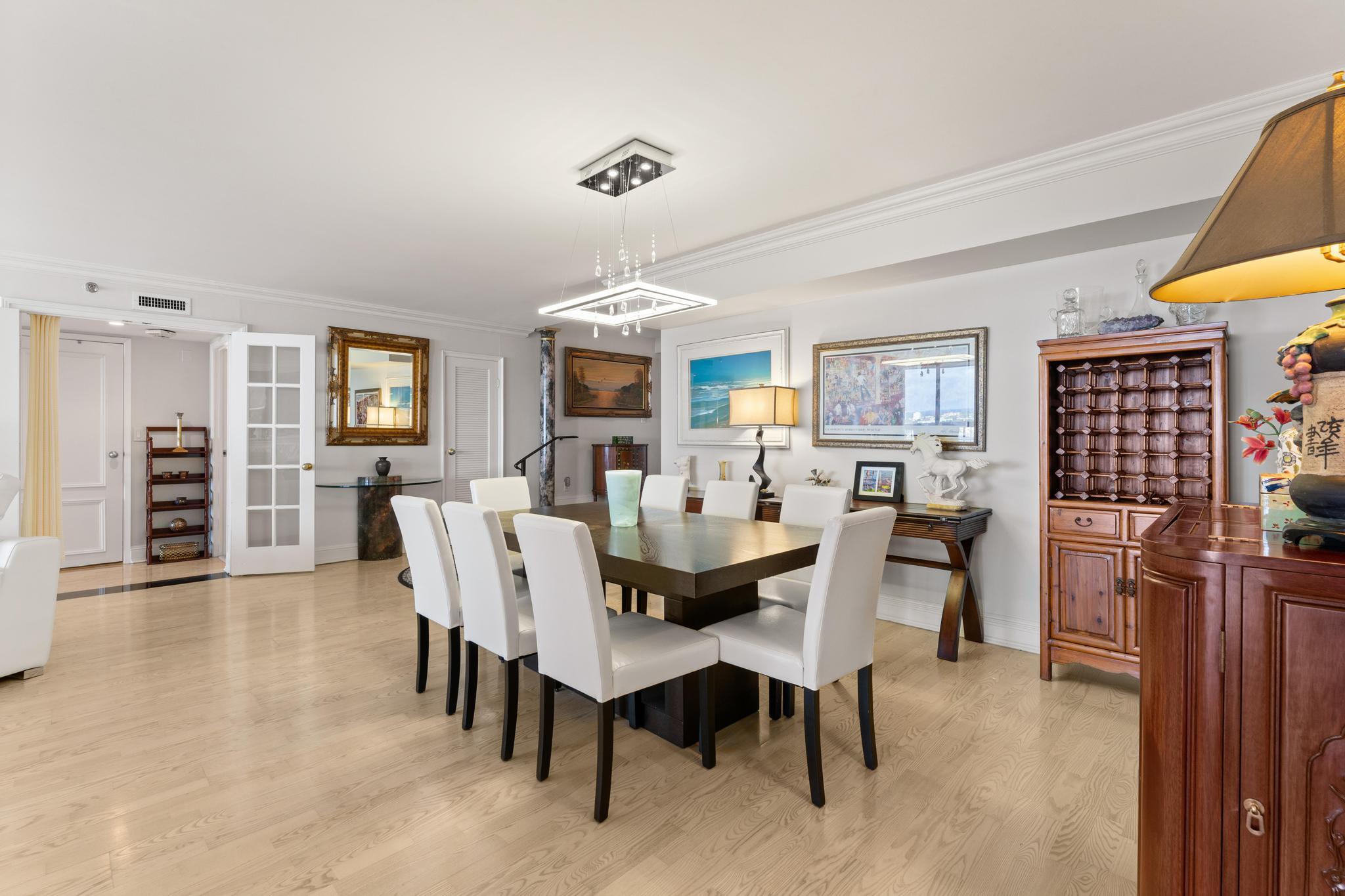 1900 Consulate Place, Unit 2002 West Palm Beach, FL 33401 - Photo 6 of 29 a view of a dining room with furniture