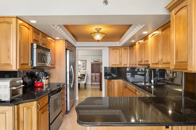 a lobby with furniture and floor to ceiling window