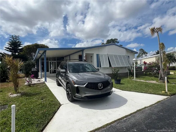 a car parked in front of a house