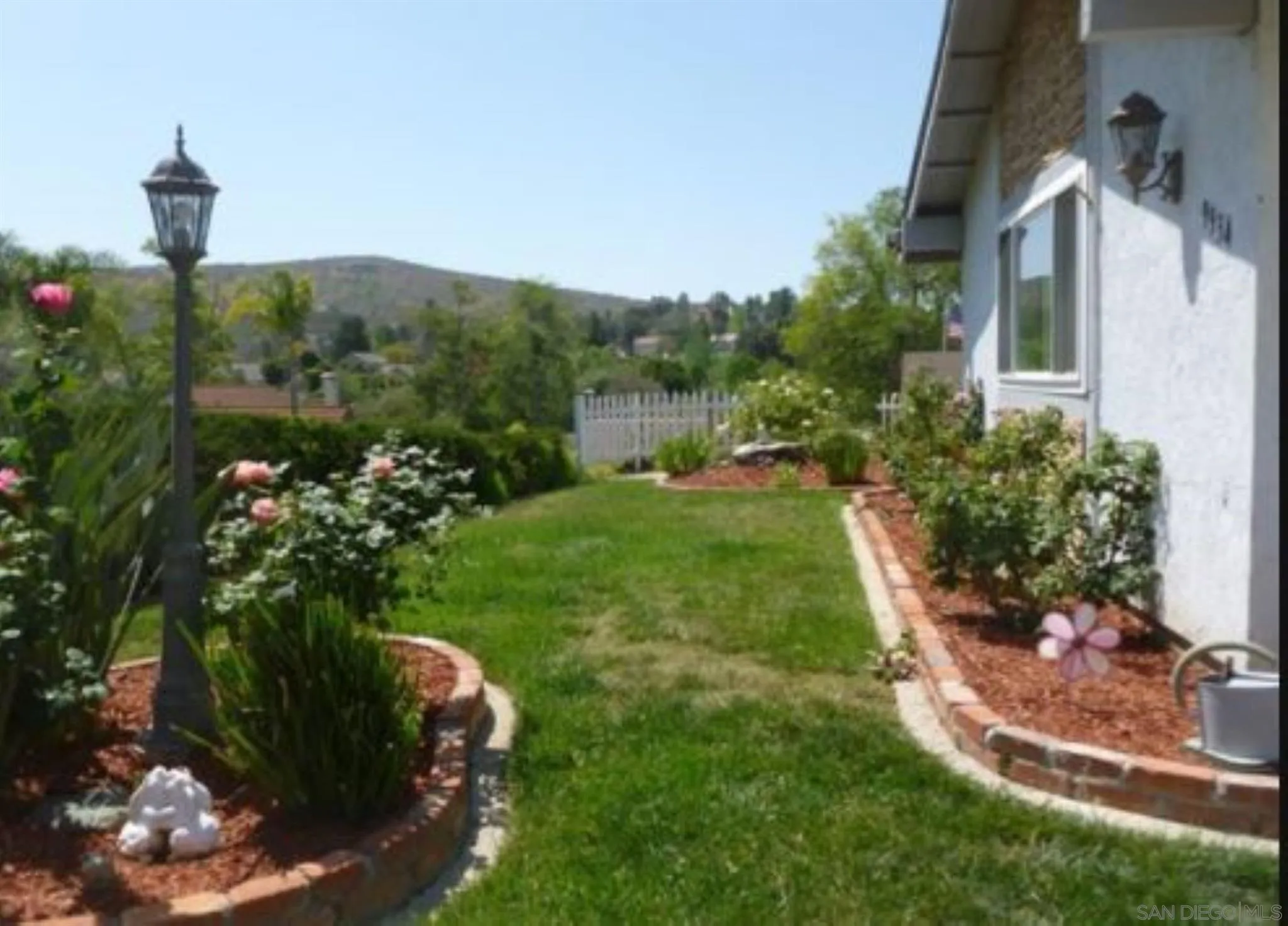 9934 Ivy Street Spring Valley, CA 91977 - Photo 2 of 12 a backyard of a house with lots of green space