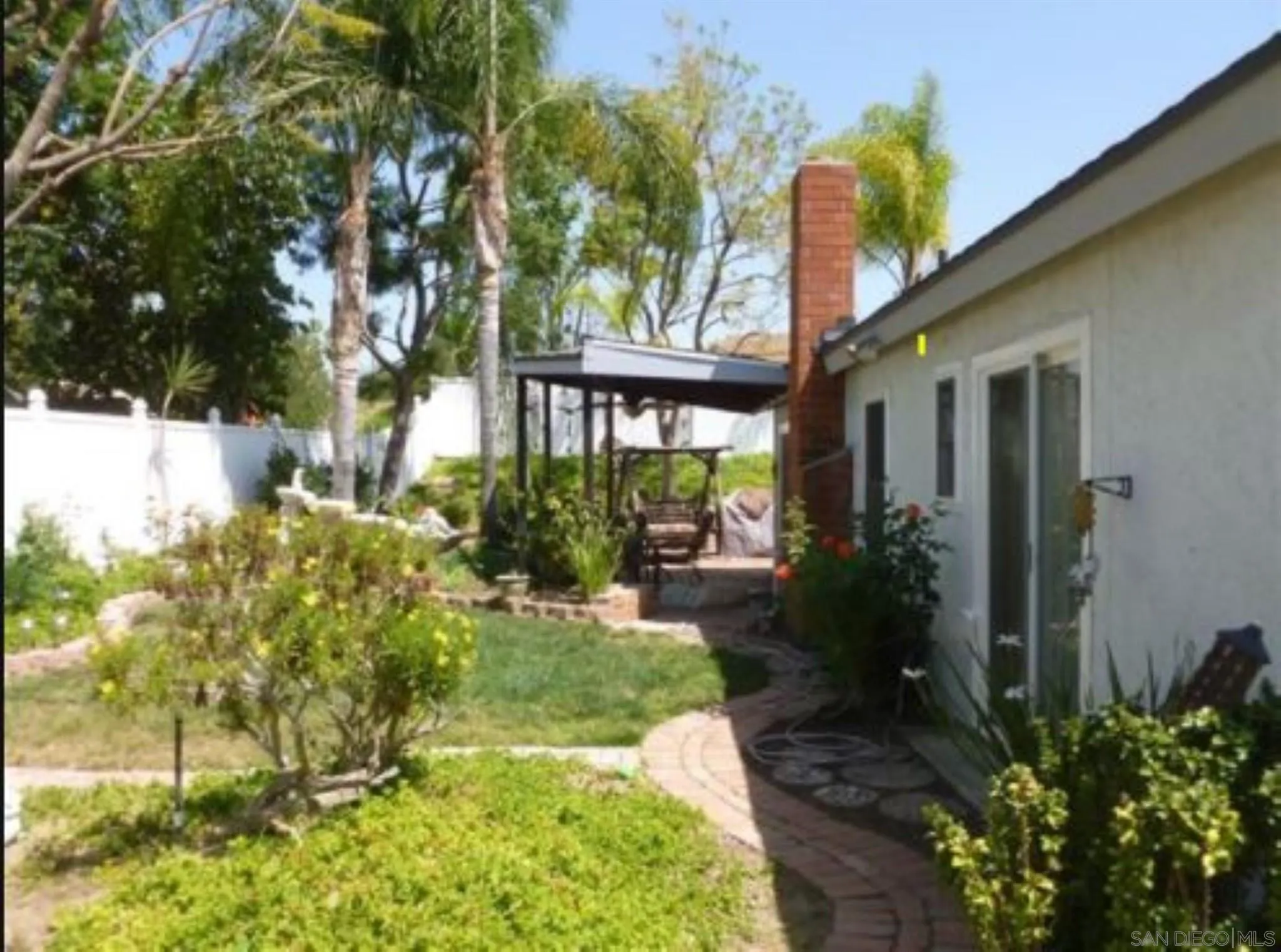 9934 Ivy Street Spring Valley, CA 91977 - Photo 3 of 12 a front view of a house with garden