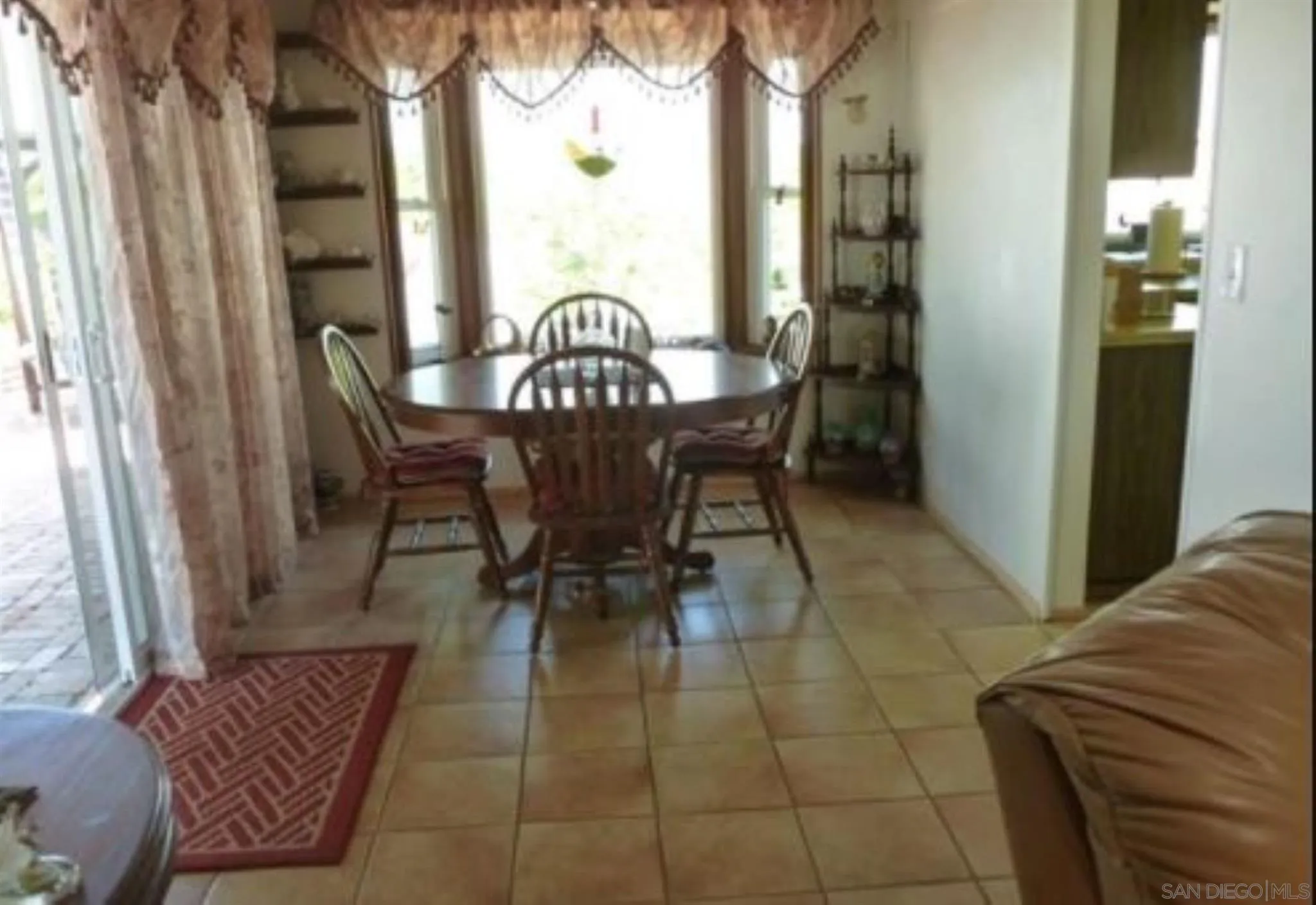 9934 Ivy Street Spring Valley, CA 91977 - Photo 5 of 12 a view of a dining room with furniture and window