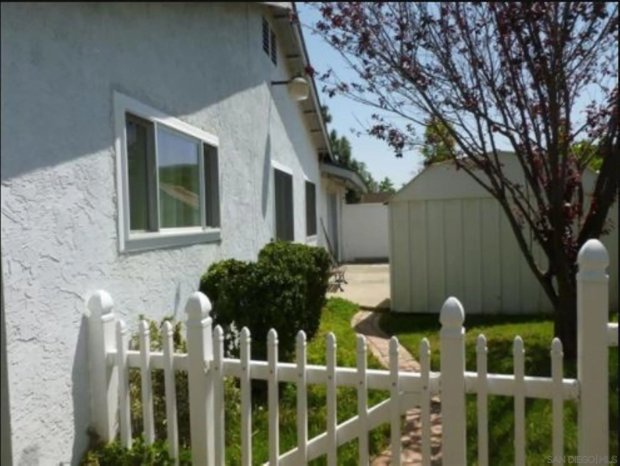 9934 Ivy Street Spring Valley, CA 91977 - Photo 9 of 12 a view of a house with wooden fence